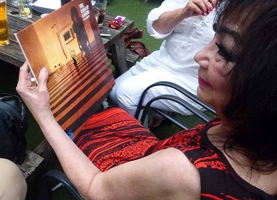Iggy Rose admiring a record cover